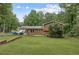 Large backyard with lawn, privacy, and wooden exterior of home at 860 The Cir, Lawrenceville, GA 30043