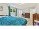 Bedroom with light walls, natural light, dresser, and full-sized bed at 860 The Cir, Lawrenceville, GA 30043