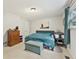 Cozy bedroom featuring carpet, window, dresser, and full-sized bed at 860 The Cir, Lawrenceville, GA 30043