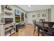 Charming kitchen with table, stainless steel appliances and a large window at 860 The Cir, Lawrenceville, GA 30043