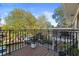 Spacious balcony with ornate railing overlooking green trees and a peek at the neighborhood at 869 Briarcliff Ne Rd # B20, Atlanta, GA 30306
