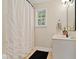 Well-maintained bathroom featuring white fixtures, neutral walls, and a shower with curtain at 869 Briarcliff Ne Rd # B20, Atlanta, GA 30306
