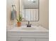 Bathroom featuring a white vanity with sink, white walls, and a framed mirror at 869 Briarcliff Ne Rd # B20, Atlanta, GA 30306