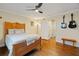 Bedroom with wood floors, guitars hanging on the wall, and a door that leads to a closet at 869 Briarcliff Ne Rd # B20, Atlanta, GA 30306