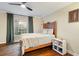 Comfortable bedroom featuring hardwood floors, neutral colors, a ceiling fan, and natural light at 869 Briarcliff Ne Rd # B20, Atlanta, GA 30306