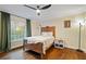 Cozy bedroom with hardwood floors, a ceiling fan, and a window with bright, natural light at 869 Briarcliff Ne Rd # B20, Atlanta, GA 30306
