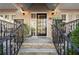 Exterior shot of the front porch with black metal railings and a glass front door at 869 Briarcliff Ne Rd # B20, Atlanta, GA 30306