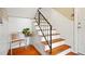 This entryway features hardwood floors, chair railing, and stairs leading to the upper level at 869 Briarcliff Ne Rd # B20, Atlanta, GA 30306