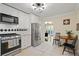 Eat-in kitchen with stainless steel refrigerator and view to a living area and outdoor patio at 869 Briarcliff Ne Rd # B20, Atlanta, GA 30306