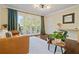 Inviting living room featuring hardwood floors and glass doors to a balcony with seating at 869 Briarcliff Ne Rd # B20, Atlanta, GA 30306