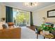 Cozy living room with stylish furniture and access to a balcony through glass doors at 869 Briarcliff Ne Rd # B20, Atlanta, GA 30306