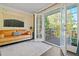 Bright living room with balcony access through glass doors and comfortable seating at 869 Briarcliff Ne Rd # B20, Atlanta, GA 30306