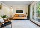 Relaxing living room with neutral walls, hardwood floors, and glass doors to an outdoor balcony at 869 Briarcliff Ne Rd # B20, Atlanta, GA 30306