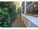 Side yard with paver pathway leading to a gated area at 869 Briarcliff Ne Rd # B20, Atlanta, GA 30306