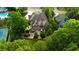 Beautiful aerial view of the home highlighting the manicured backyard, patio, and surrounding lush greenery at 443 Langley Oaks Dr, Marietta, GA 30067