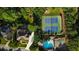 Aerial view of property showcasing pool, tennis courts, and landscaped grounds at 443 Langley Oaks Dr, Marietta, GA 30067