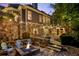 Multi-level backyard with stone accents, fire pit, and outdoor living spaces at 443 Langley Oaks Dr, Marietta, GA 30067
