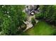 Stunning backyard featuring a stone patio, lush landscaping, and outdoor seating areas perfect for entertaining at 443 Langley Oaks Dr, Marietta, GA 30067