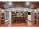 Basement bar with wood cabinets, seating and great lighting at 443 Langley Oaks Dr, Marietta, GA 30067