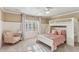 Cozy bedroom with a unique lofted bed, soft carpet, and a bright window at 443 Langley Oaks Dr, Marietta, GA 30067