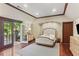 Cozy bedroom with hardwood floors and access to outdoor patio at 443 Langley Oaks Dr, Marietta, GA 30067