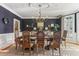 Formal dining room with dark walls, elegant chandelier, and shuttered windows at 443 Langley Oaks Dr, Marietta, GA 30067