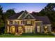 Beautiful two-story home with manicured lawn, stone accents, and elegant curb appeal at 443 Langley Oaks Dr, Marietta, GA 30067