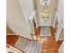 Elegant foyer with hardwood floors, grand chandelier, and staircase at 443 Langley Oaks Dr, Marietta, GA 30067