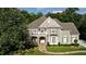 Charming two-story home with a stone walkway, manicured lawn, and inviting front porch at 443 Langley Oaks Dr, Marietta, GA 30067