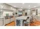 Spacious kitchen features a marble island, stainless steel appliances, and hardwood floors at 443 Langley Oaks Dr, Marietta, GA 30067