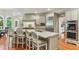 Stylish kitchen features a marble island, stainless steel appliances, and breakfast bar seating at 443 Langley Oaks Dr, Marietta, GA 30067