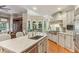 Bright kitchen features a marble island, stainless steel appliances, and hardwood floors at 443 Langley Oaks Dr, Marietta, GA 30067