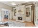 Cozy living room with fireplace, built-in bookshelves, and ample natural light at 443 Langley Oaks Dr, Marietta, GA 30067