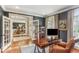 Home office with dark walls, wood floors, french doors and view of the dining room at 443 Langley Oaks Dr, Marietta, GA 30067