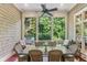 Inviting screened porch with outdoor dining, comfortable seating and wooded views at 443 Langley Oaks Dr, Marietta, GA 30067