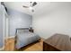 Cozy bedroom with hardwood floors, a ceiling fan, and a closet with sliding mirror doors at 800 Peachtree Ne St # 8607, Atlanta, GA 30308