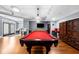 Community billiards room with a pool table, red chairs and a cabinet at 800 Peachtree Ne St # 8607, Atlanta, GA 30308