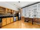 Bright kitchen with stainless steel appliances, wooden cabinets, a mosaic tile backsplash, and hardwood floors at 800 Peachtree Ne St # 8607, Atlanta, GA 30308