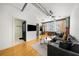 Open concept living room featuring hardwood floors, modern lighting, and an exposed ceiling at 800 Peachtree Ne St # 8607, Atlanta, GA 30308