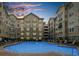 Beautiful apartment complex with a large pool, lounge chairs, and well-manicured landscaping at 800 Peachtree Ne St # 8607, Atlanta, GA 30308