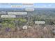 Roswell, GA aerial view of home with wooded surroundings and close to schools and Shallowford Rd at 10845 Shallowford Rd, Roswell, GA 30075