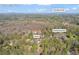 Aerial view of a home with a large wooded lot close to Shallowford Rd and Woodstock Rd in Roswell, GA at 10845 Shallowford Rd, Roswell, GA 30075