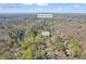 Roswell, GA aerial view of home with wooded surroundings and close to Shallowford Rd at 10845 Shallowford Rd, Roswell, GA 30075