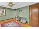 Basement area featuring hardwood floors, a bright window and two dog kennels at 10845 Shallowford Rd, Roswell, GA 30075