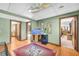 Spacious basement with unique ceiling, bright lights, hardwood floors, and open doorways at 10845 Shallowford Rd, Roswell, GA 30075