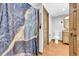 Well lit bathroom featuring a decorative shower curtain, wood-look flooring, and a stylish vanity at 10845 Shallowford Rd, Roswell, GA 30075