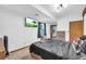 Bedroom featuring natural light, a mounted TV, and neutral carpet at 10845 Shallowford Rd, Roswell, GA 30075