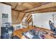 Upstairs bonus room with a wooden ceiling and floors, open to the stair case at 10845 Shallowford Rd, Roswell, GA 30075