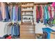 Large walk-in closet with abundant hanging space, shelving, and drawer storage, ideal for organizing wardrobes at 10845 Shallowford Rd, Roswell, GA 30075