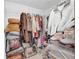 Spacious walk-in closet with ample storage for clothes, shoes, and accessories to maximize organization at 10845 Shallowford Rd, Roswell, GA 30075